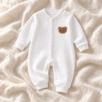 The Classic Button Knit Romper — white on ivory linen