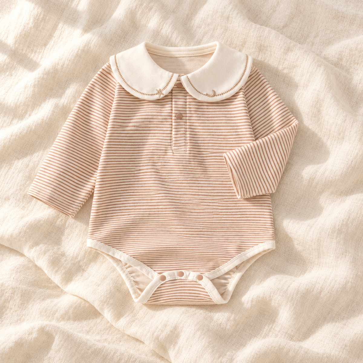 The Sailor Stripe Cotton Romper — khaki-B studio flat lay on warm ivory linen