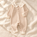 The Sailor Stripe Cotton Romper — Khaki studio flat lay on warm ivory linen