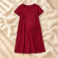 Short-Sleeve Maternity Nursing Nightdress in Red, photographed on warm cream linen