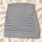 Tots & Moms stretch maternity band — grey — product on cream linen