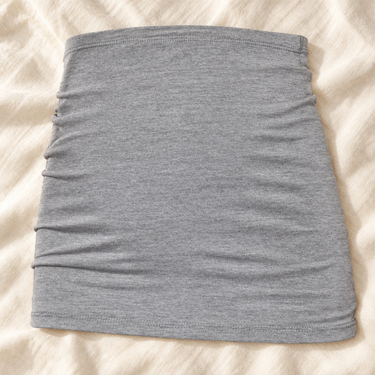 Tots & Moms stretch maternity band — grey — product on cream linen