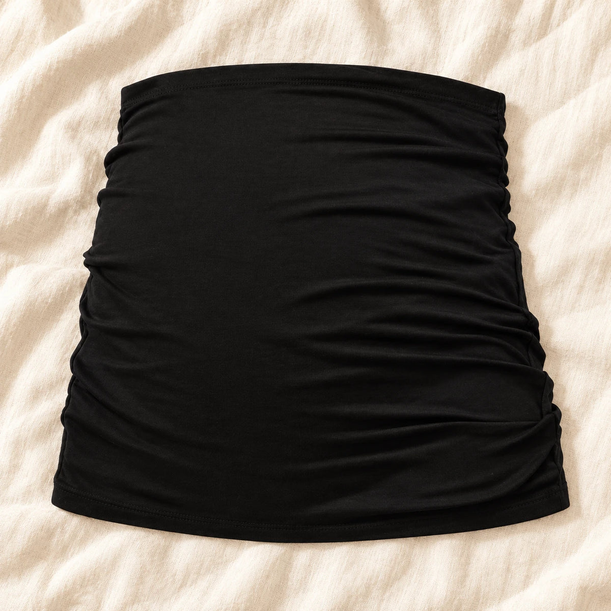 Tots & Moms stretch maternity band — black / China Mainland / M — product on cream linen