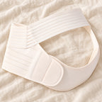 Tots & Moms adjustable pregnancy support belt — M / White — product on cream linen