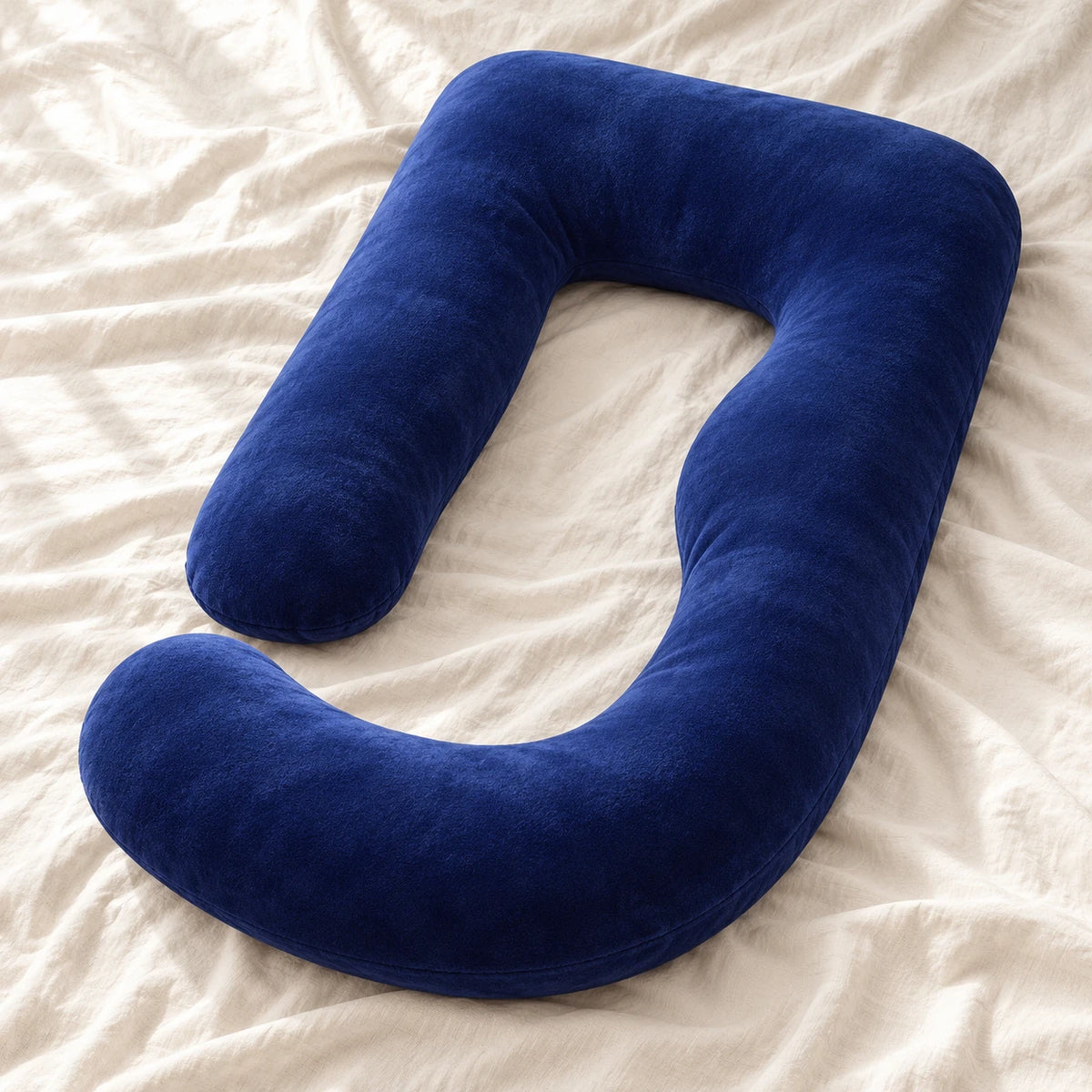 Full-Body Pregnancy Pillow with Washable Cover — Dark blue — product on cream linen