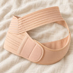 Tots & Moms adjustable pregnancy support belt — M / Nude — product on cream linen