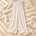 Drawstring Wide-Leg Maternity Trousers in Apricot, photographed on warm cream linen