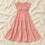 Sleeveless Tiered Maternity Dress — Pink — on cream linen