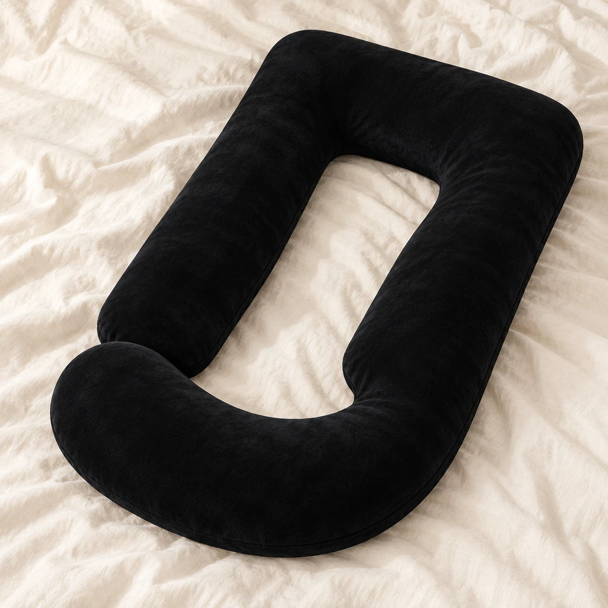 Full-Body Pregnancy Pillow with Washable Cover — Black — product on cream linen
