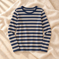 Striped Long-Sleeve Nursing Top in Navy Blue, photographed on warm cream linen