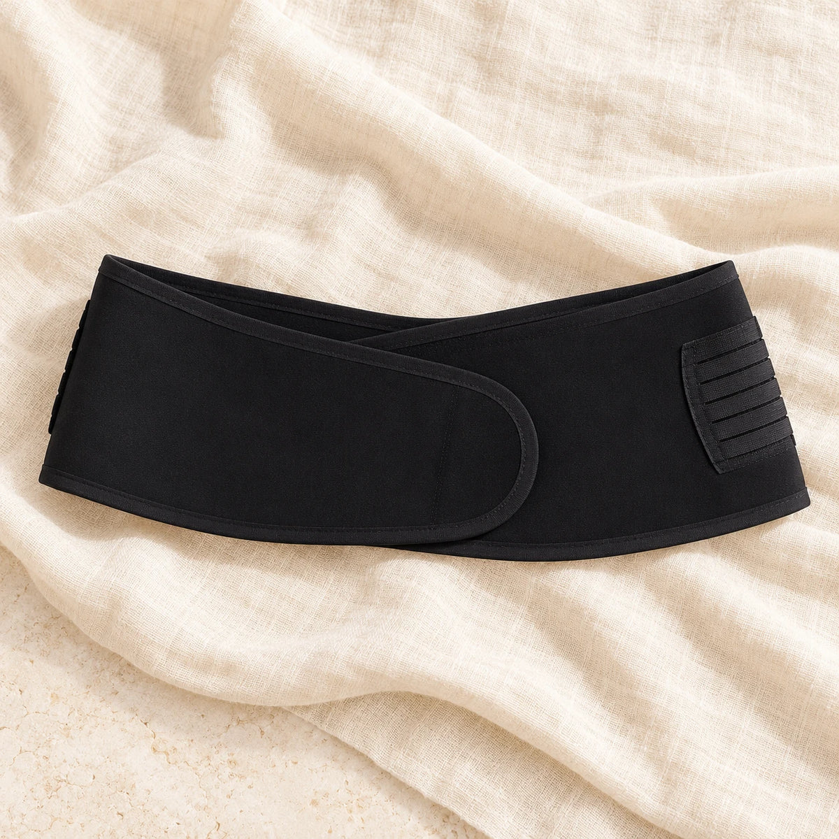 Maternity Waist Support Band — Black, photographed on cream linen