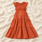 Sleeveless Tiered Maternity Dress — Orange — on cream linen