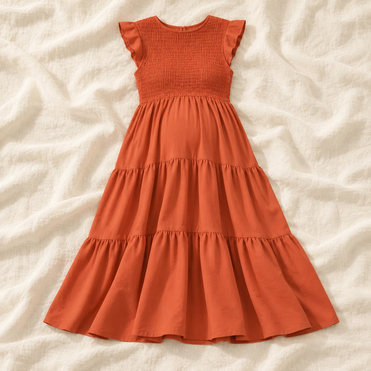 Sleeveless Tiered Maternity Dress — Orange — on cream linen