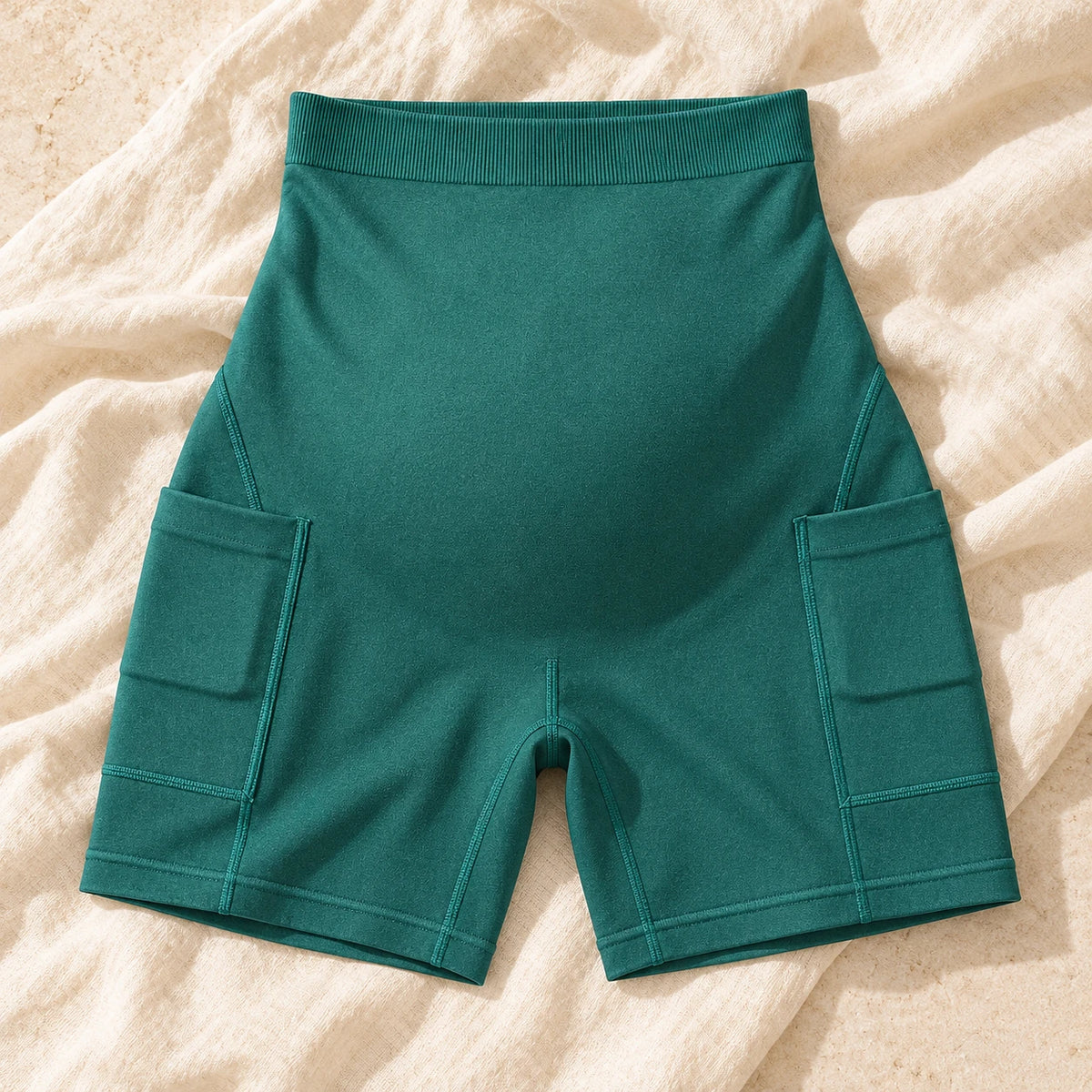 Over-Bump Maternity Active Shorts with Pockets — green, product on cream linen