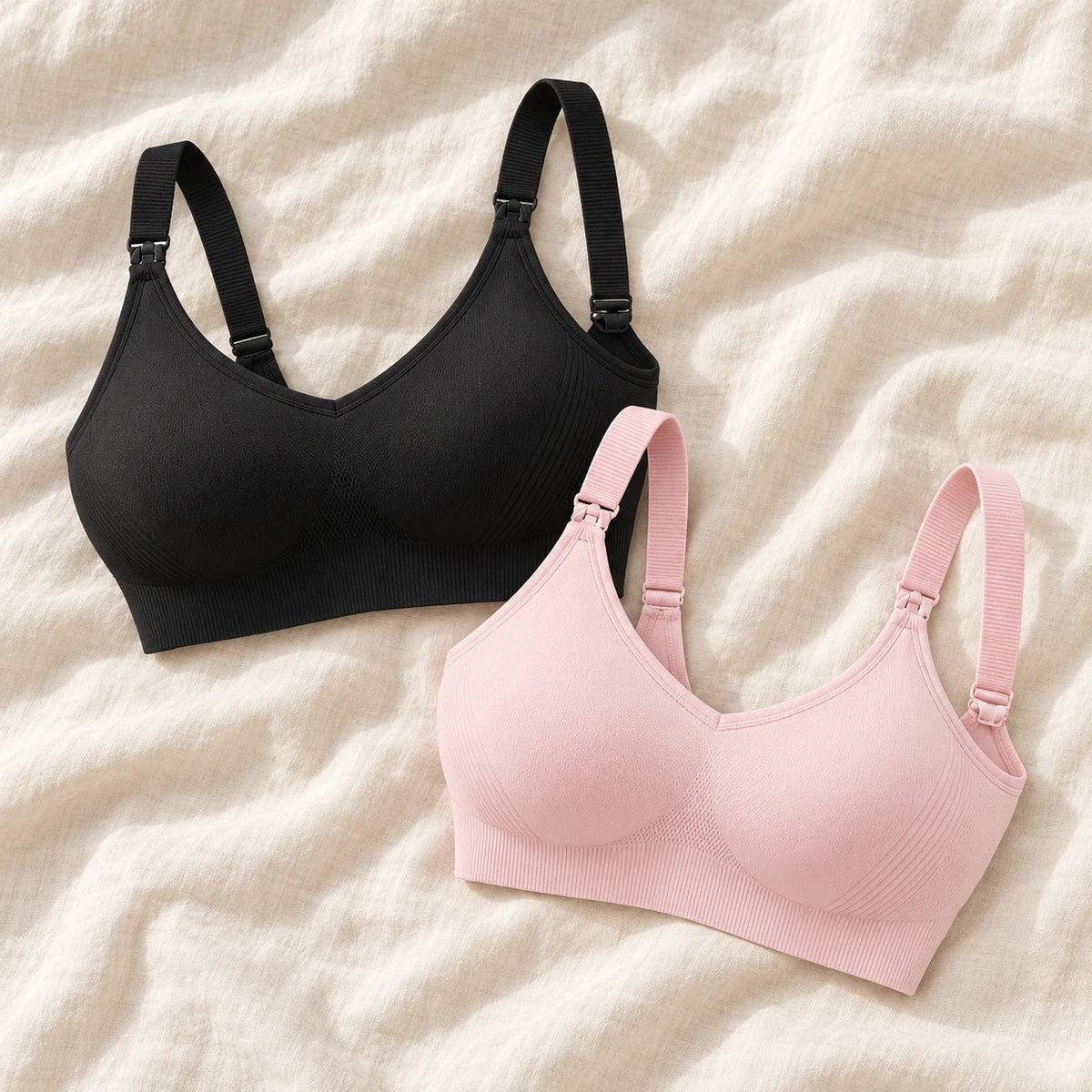 Wireless Clip-Down Nursing Bra — Single & Two-Packs — 2 bras — Black + Pink, photographed on cream linen