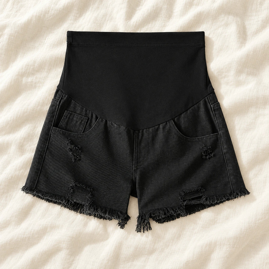 Distressed Maternity Denim Shorts — Style Black — full belly panel — on cream linen