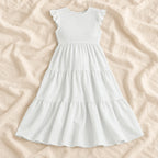 Sleeveless Tiered Maternity Dress — WHITE — on cream linen