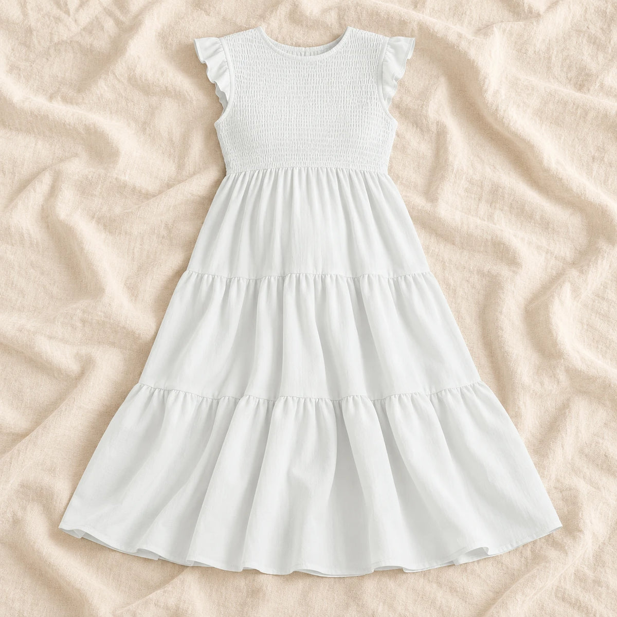 Sleeveless Tiered Maternity Dress — WHITE — on cream linen