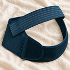 Tots & Moms adjustable pregnancy support belt — M / NAVY — product on cream linen