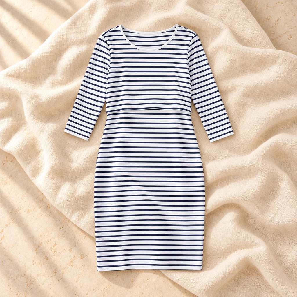 Striped Three-Quarter Sleeve Nursing Dress in WHITE, photographed on warm cream linen