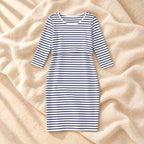 Striped Three-Quarter Sleeve Nursing Dress in WHITE, photographed on warm cream linen