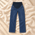 Adjustable-Waist Wide-Leg Maternity Jeans in Dark Blue, photographed on warm cream linen