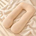 U-Shaped Pregnancy Pillow with Removable Cover in Beige, photographed on warm cream linen