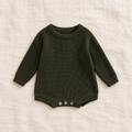 Button knit baby romper in army green, boutique studio photograph