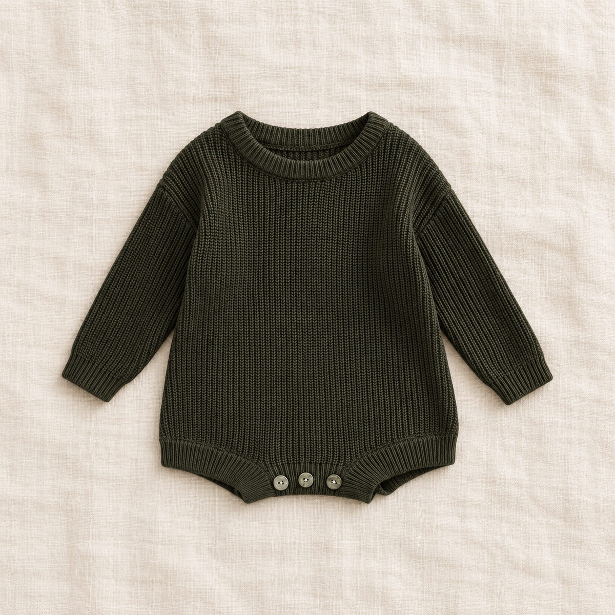Button knit baby romper in army green, boutique studio photograph