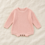 Button knit baby romper in Light Pink, boutique studio photograph