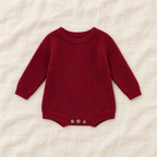 Button knit baby romper in Wine Red, boutique studio photograph