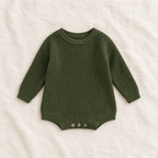Button knit baby romper in Dark Green, boutique studio photograph