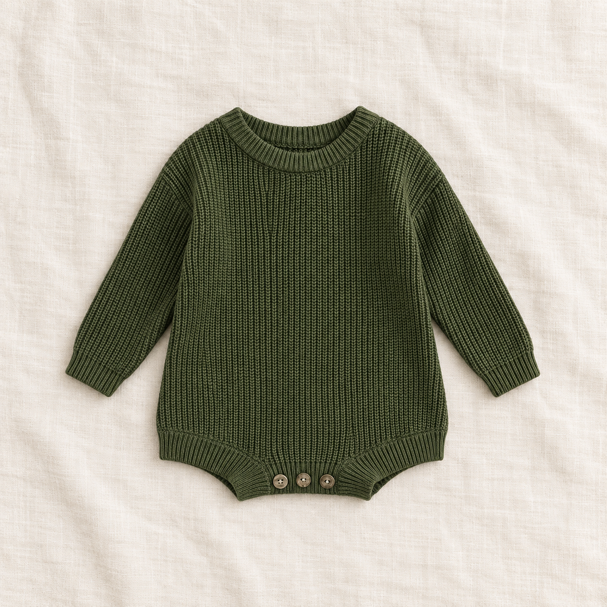 Button knit baby romper in Dark Green, boutique studio photograph