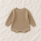 Button knit baby romper in Light khaki, boutique studio photograph