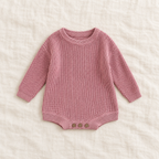 Button knit baby romper in Rose Powder, boutique studio photograph
