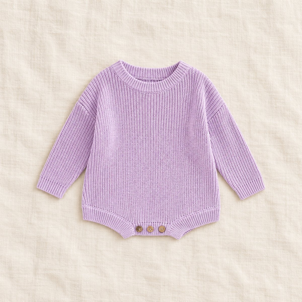 Button knit baby romper in PURPLE, boutique studio photograph
