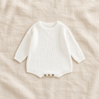 Button knit baby romper in WHITE, boutique studio photograph