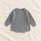 Button knit baby romper in GRAY, boutique studio photograph
