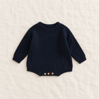 Button knit baby romper in Navy Blue, boutique studio photograph
