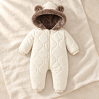 Cream beige fleece lined hooded baby romper on ivory linen