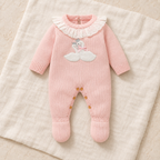 Blush pink goose knit footed baby romper on ivory linen