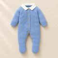 The Blue Collared Cable Knit Romper on ivory linen