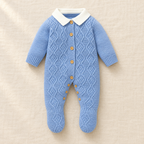 The Blue Collared Cable Knit Romper on ivory linen
