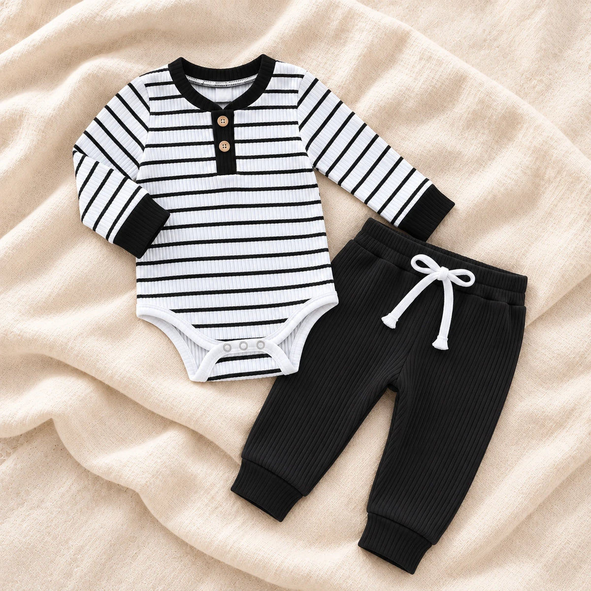 The Stripe Romper & Trouser Set — Black Stripe — studio product photograph