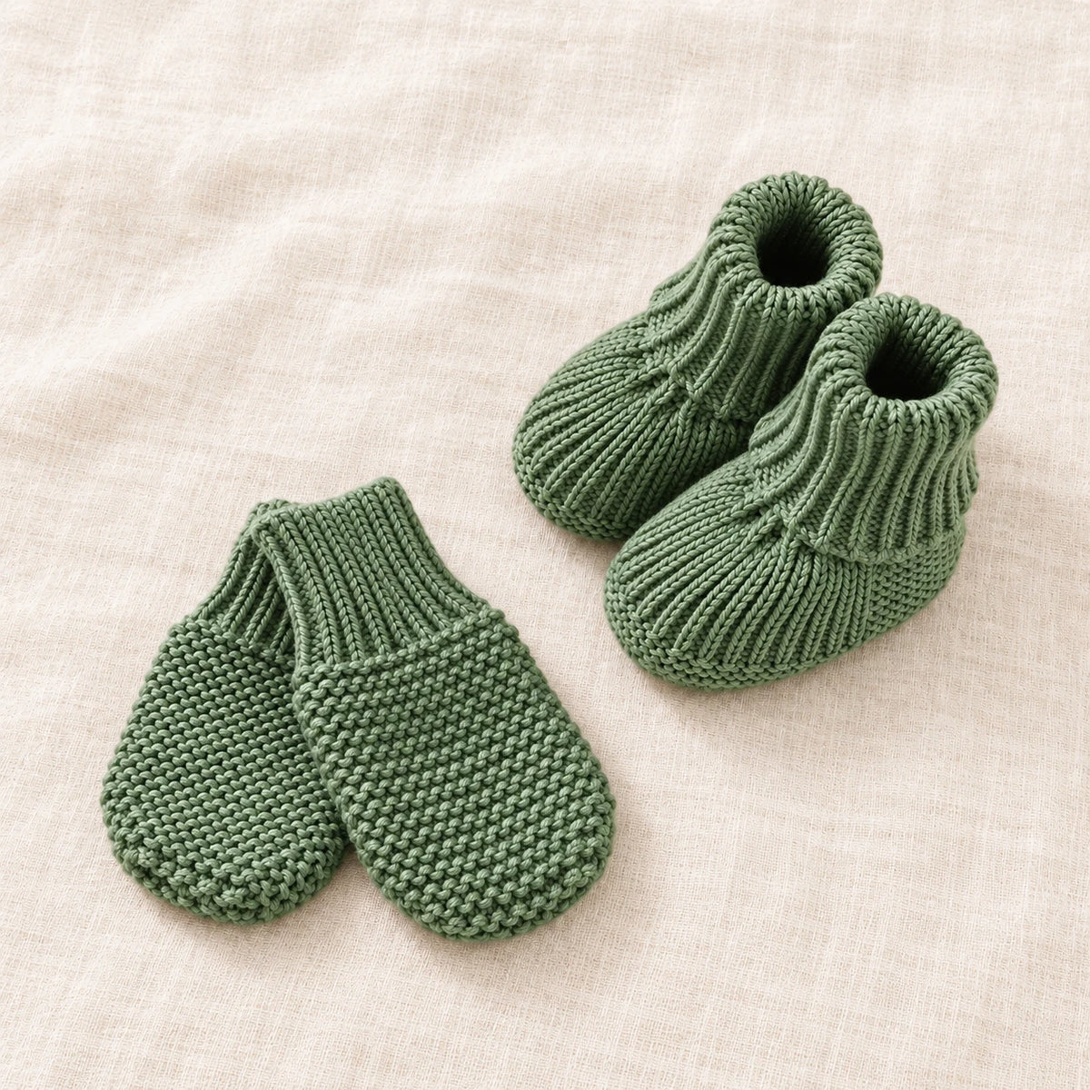 The Newborn Knit Wardrobe — Forest · Booties & Mittens — studio product photograph