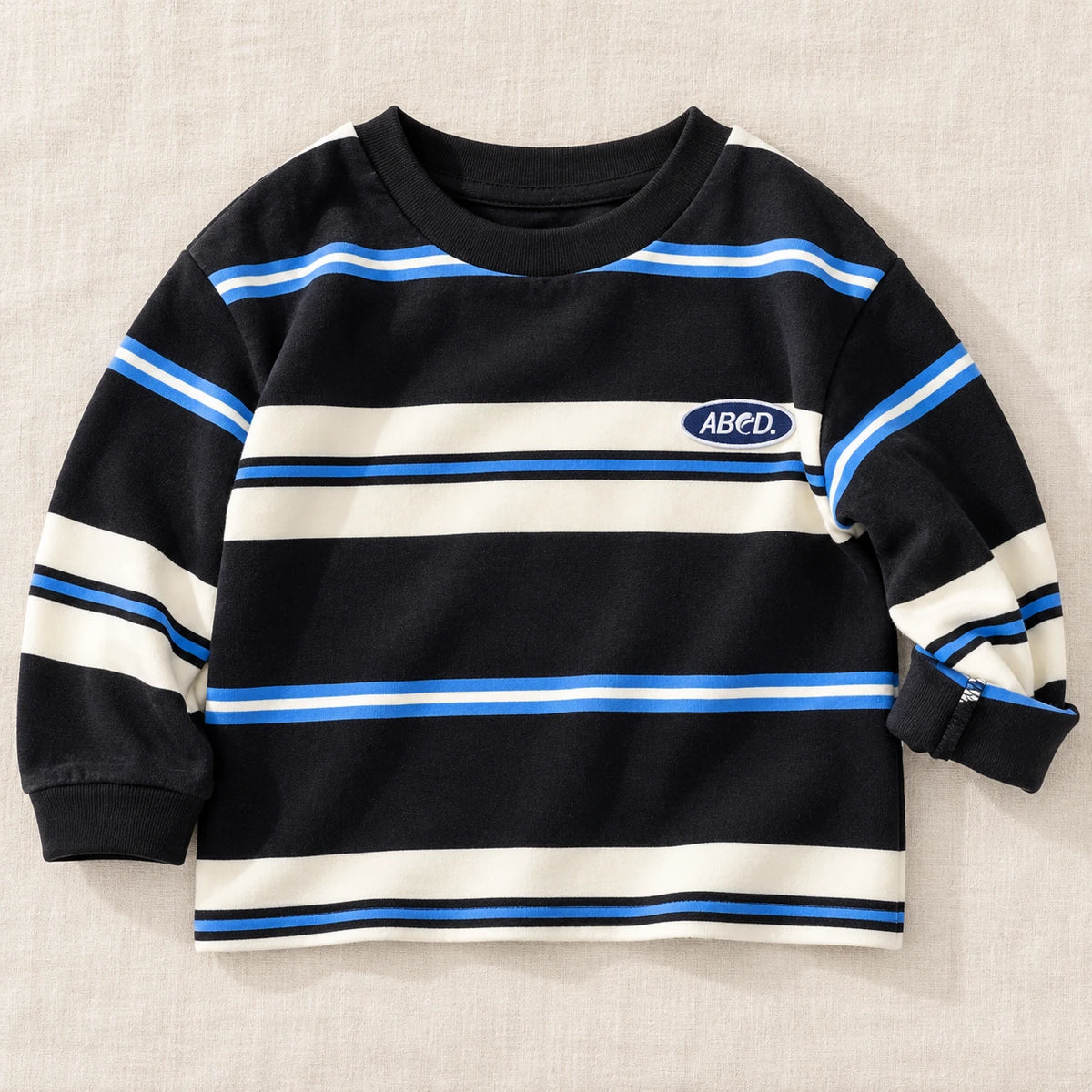 The Color Stripe Long-Sleeve Top — Black — studio product photograph