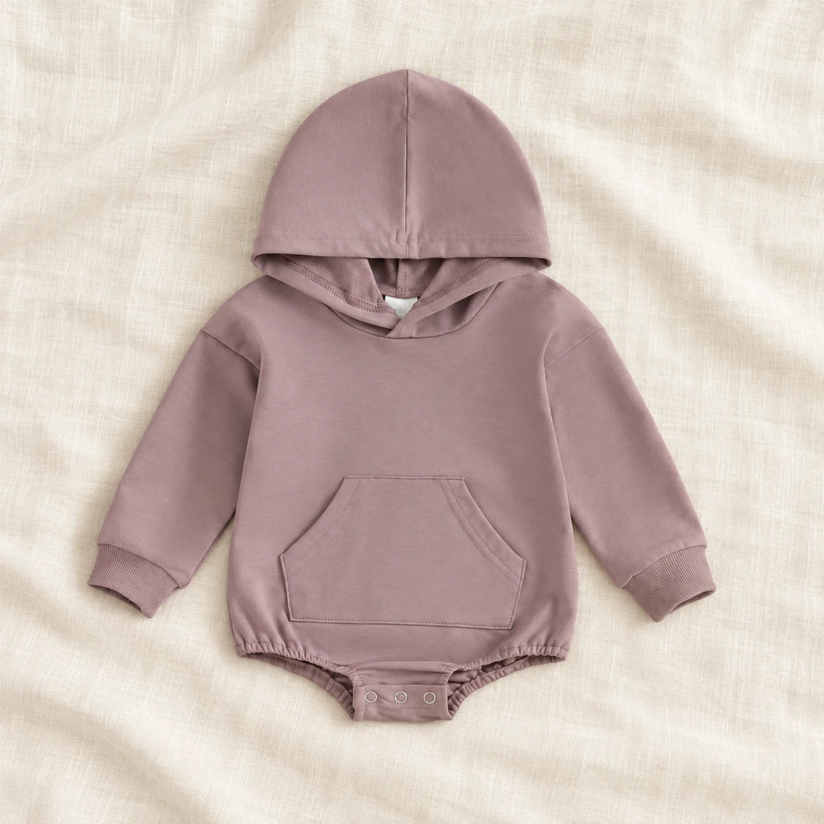 The Pocket Hooded Baby Romper — Purple — studio product photograph