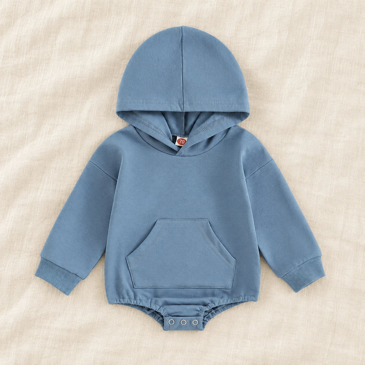 The Pocket Hooded Baby Romper — Blue — studio product photograph