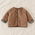The Reversible Plaid & Teddy Jacket — Khaki — studio product photograph