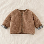 The Reversible Plaid & Teddy Jacket — Khaki — studio product photograph